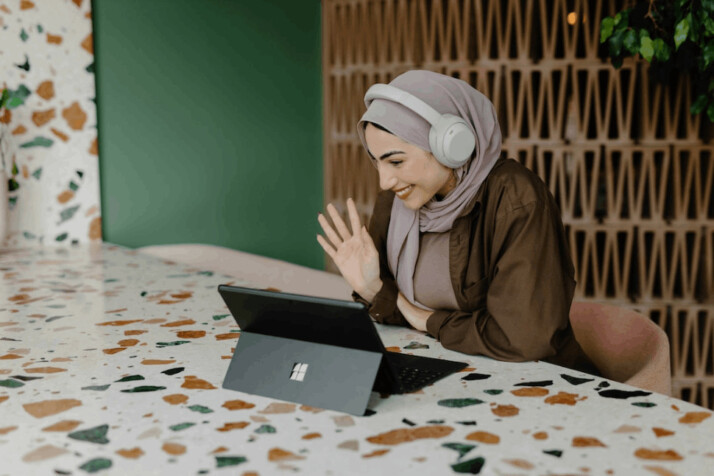 A women sitting front of laptop