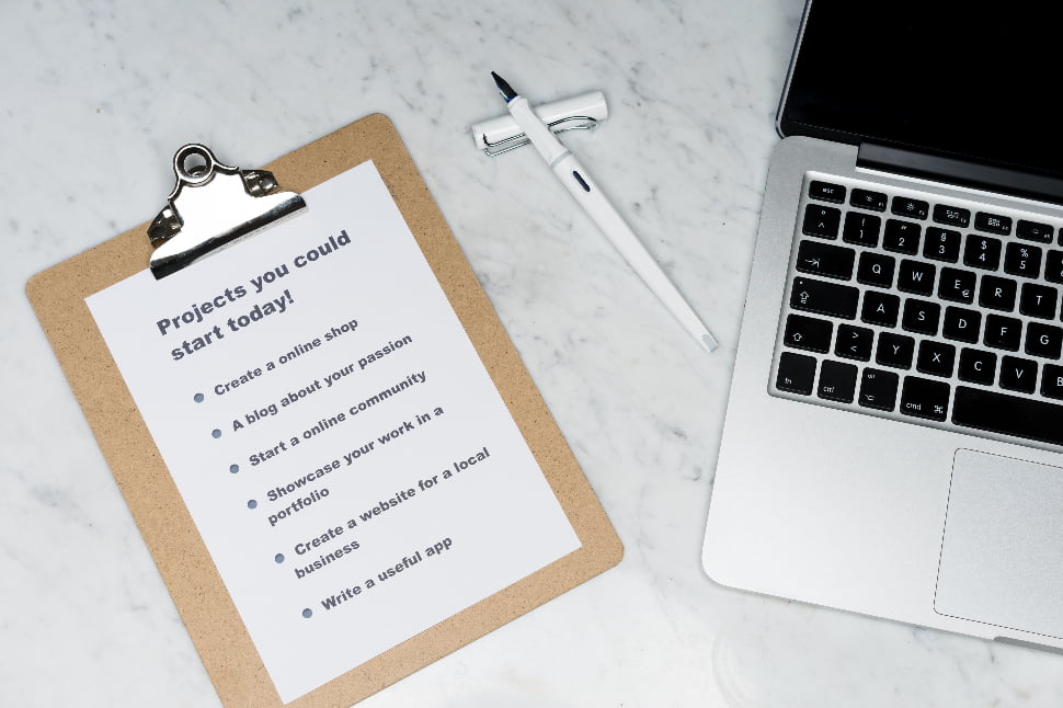 A list of projects you could start today placed on a clipboard.