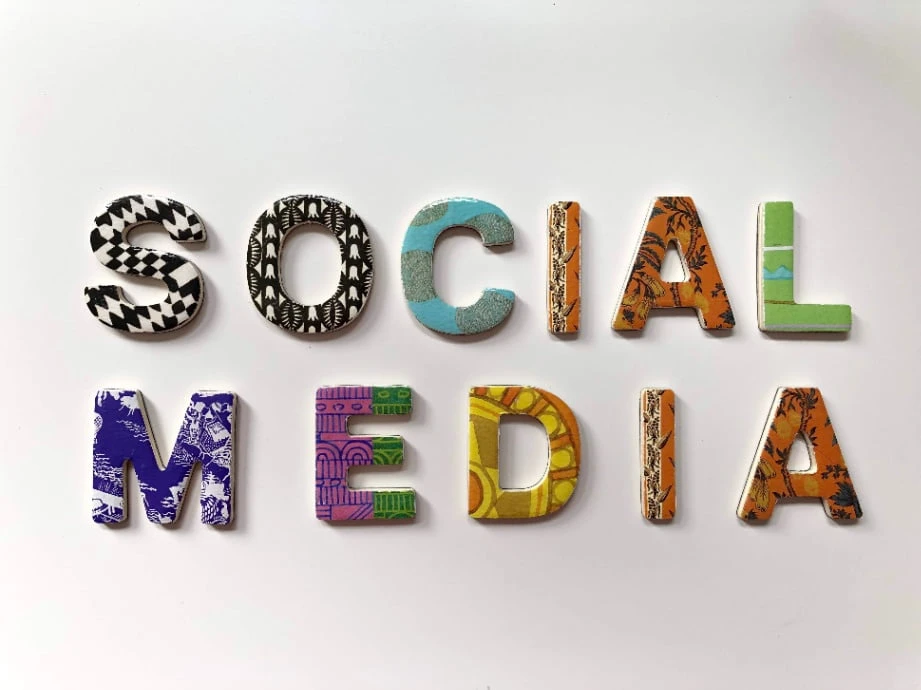 Colorful and patterned SOCIAL MEDIA text on a white background. 