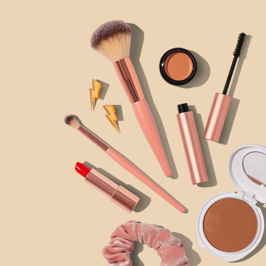 An assemblage of make-up kits, including lipstick and mascara.
