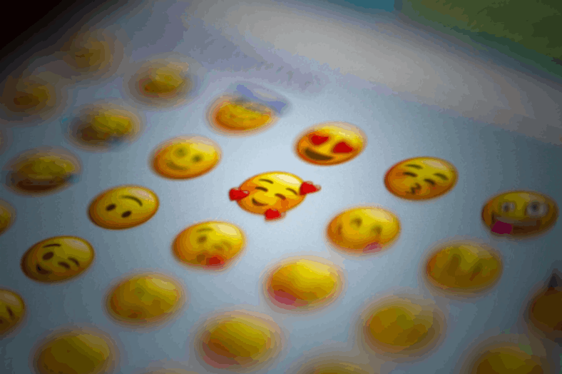 smileys and emojis of different kinds arranged in a row