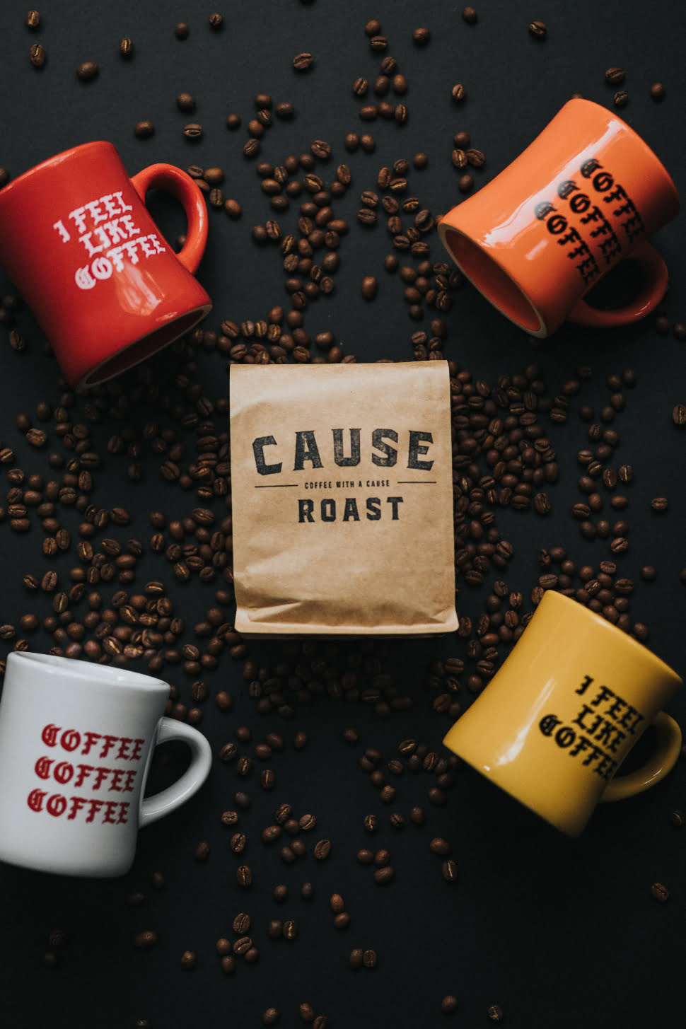 Roasted coffee beans with 4 coffee mugs with a text related to coffee.