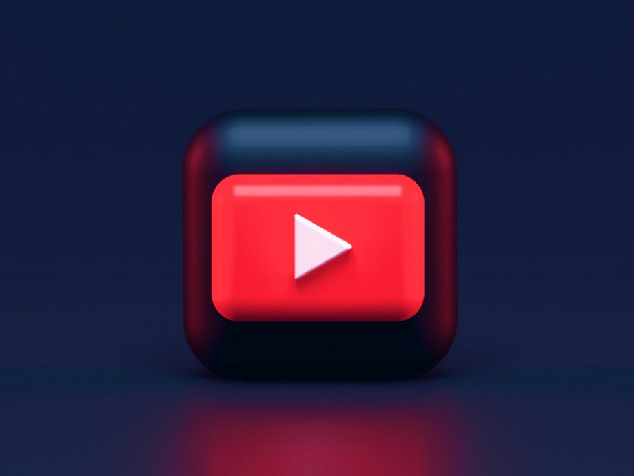 A 3D rendered red play button, the official YouTube logo.
