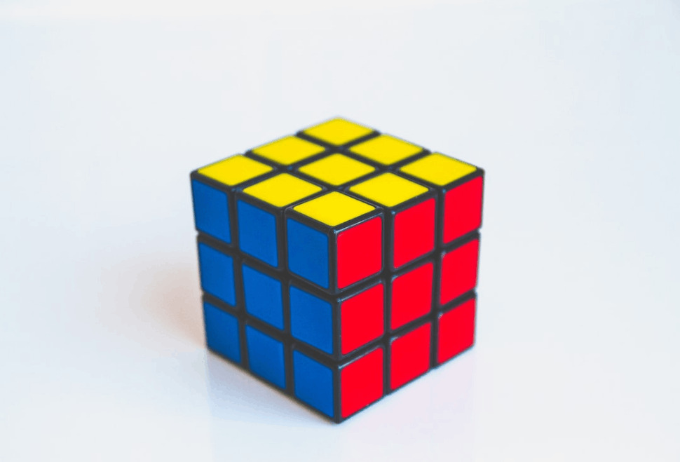 yellow, blue, and red 3x3 puzzle cube toy