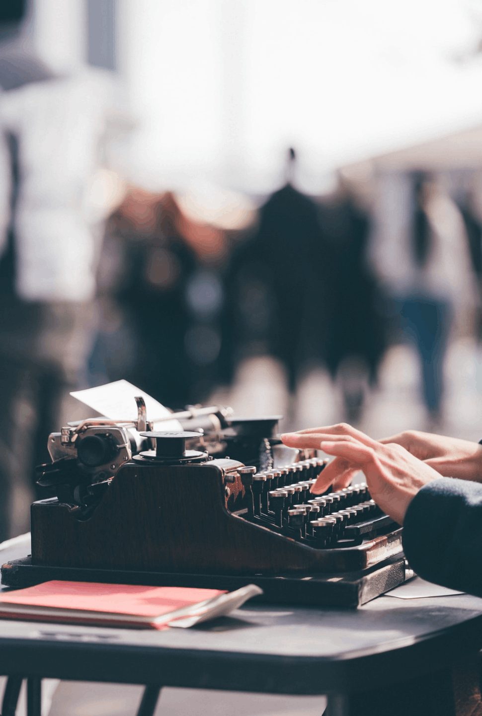 An author using a black typewriter because using this with her writing style is effective