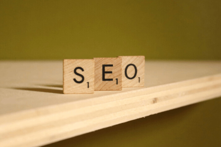 SEO text on brown wooden scrabble blocks on a table