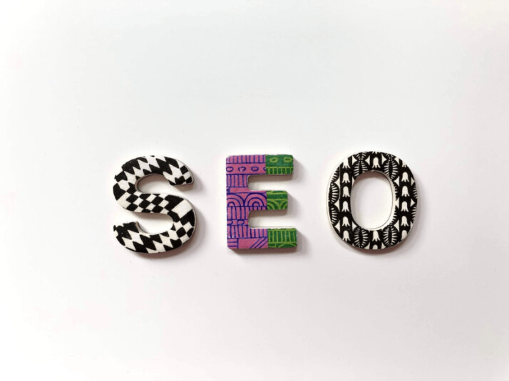 SEO text wallpaper with colorful and grayscale patterns on the letters