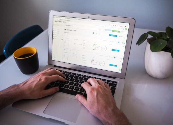 A man working on a set of data on his laptop.