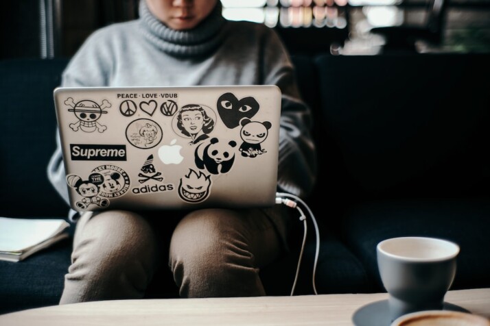 A person working on MacBook Pro