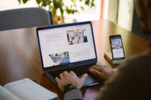 A person working on a website on their laptop.