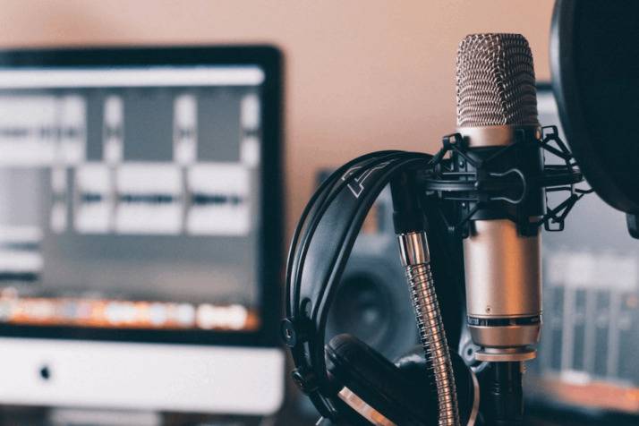 black and silver headphones on black and silver microphone